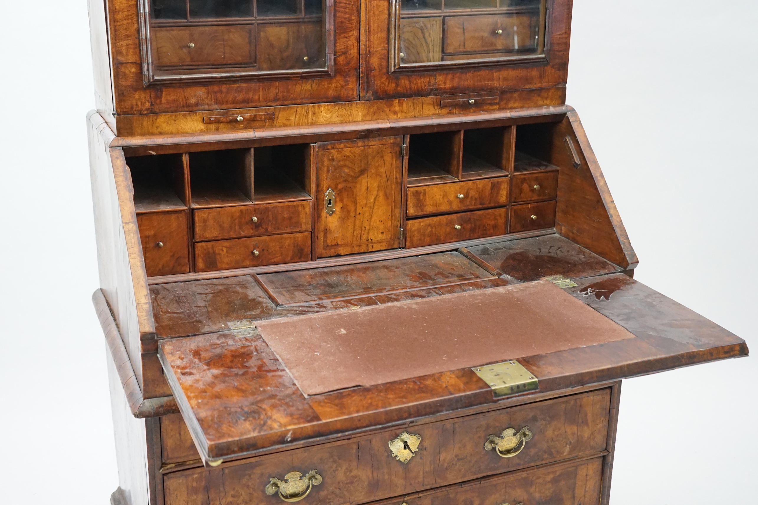 An early 18th century walnut bureau bookcase